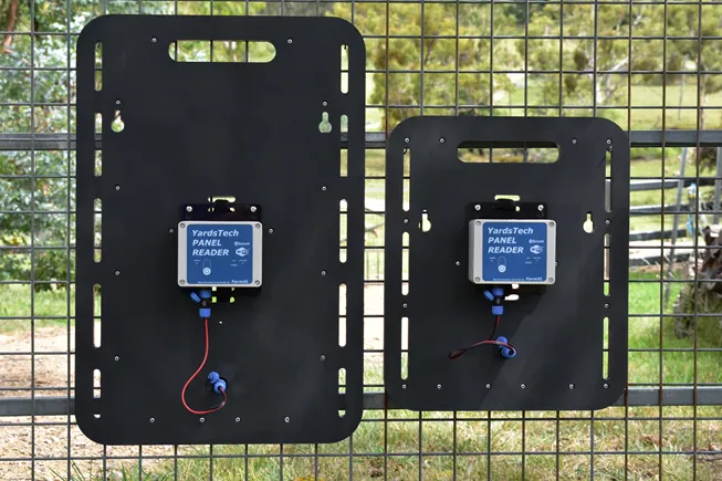 Large and small YardsTech&reg; Panel Readers mounted on a yard gate